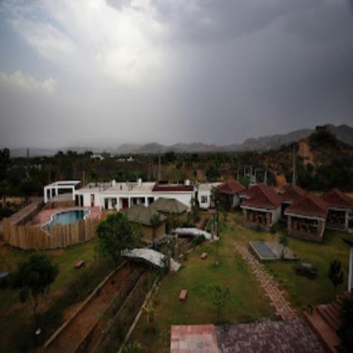 an aerial view of a village with houses at Virat Resorts, Sariska Rajasthan in Bairāt