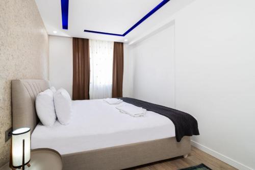 Postel nebo postele na pokoji v ubytování Modern and Central Home near Beach in the Heart of Antalya