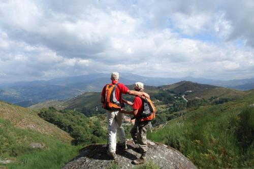two men standing on top of a mountain at GoToGeres - Casa do Lagar - Sobrenatura in Arcos de Valdevez