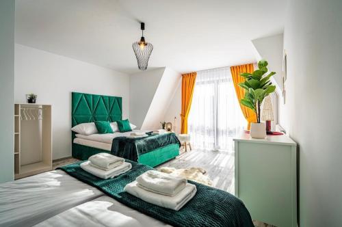 Postel nebo postele na pokoji v ubytování Wierchowa Chałupa Jacuzzi & Sauna