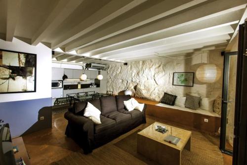 a living room with a couch and a table at GoToGeres - Casa da Ramada - Sobrenatura in Arcos de Valdevez