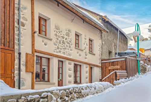 a house with snow on the side of it at Chalet Ruby in Les Deux Alpes