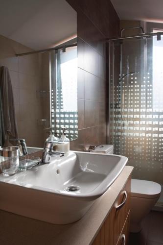 a bathroom with a sink and a toilet at Casa Markaida Vizcaya in Mungia