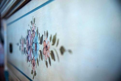 a wall with a painting of flowers on it at Charming House in Amelia with Lake View, 200 m² in Amelia