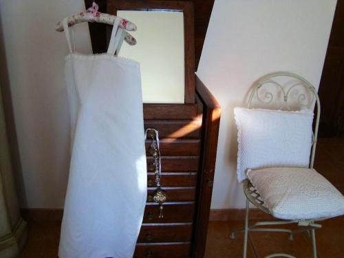 a wedding dress and a chair in a room at Charming House in Amelia with Lake View, 200 m² in Amelia