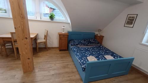 Postel nebo postele na pokoji v ubytování Apartmány stará škola