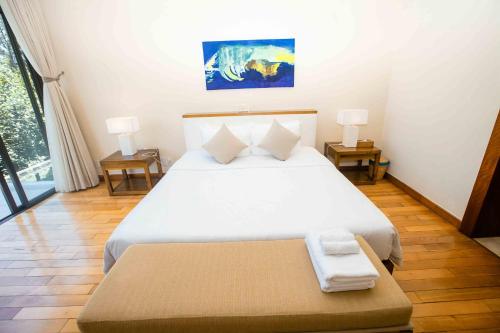 Ένα ή περισσότερα κρεβάτια σε δωμάτιο στο Sunny Beach Villa