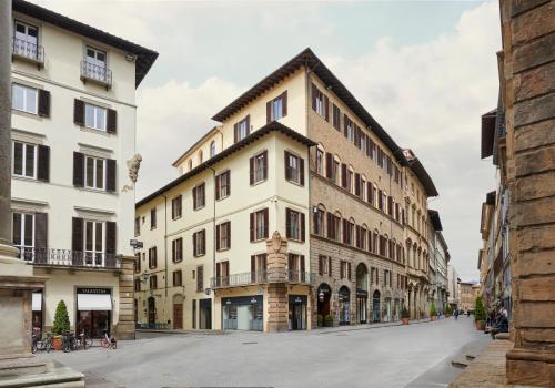 a building in the middle of a street at IL Tornabuoni The Unbound Collection by Hyatt in Florence
