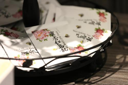 a cake with flowers on it sitting on a table at Hualien Pink Corner Hotel in Hualien City