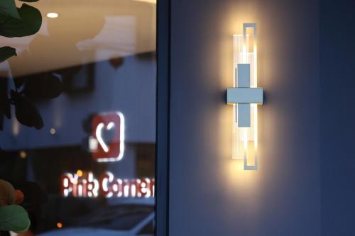 a close up of a door with a light on it at Hualien Pink Corner Hotel in Hualien City