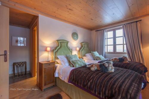 a bedroom with two beds in a room at Chalet Le Ferme Combloux Rhone-Alps in Combloux