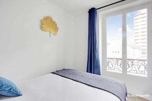 Voodi või voodid majutusasutuse CMG Cosy apartment Ourcq - Jean Jaurès 6P-2BR toas