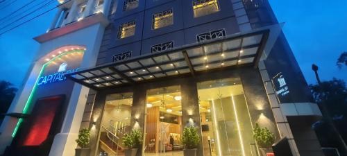 a store front of a building at night at Capital Park Residency in Trivandrum