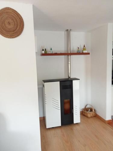 a room with a stove in the corner of a room at Casas da Nazaré2 in Ponte de Lima
