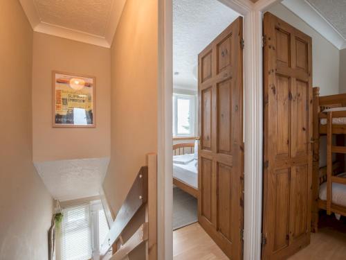 a room with a staircase and a room with a door at Pass the Keys 2 Bedroom chalet Fully equipped with Parking WiFi in Pembroke