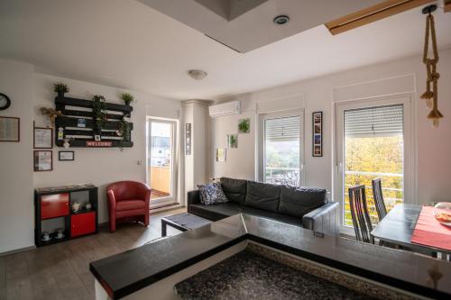 a living room with a couch and a table at Apartment Biscan in Sveta Nedelja