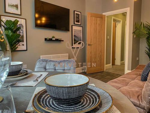 a living room with a large bowl on a table at Velveteen by The V Group in Blackpool