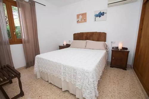 Postel nebo postele na pokoji v ubytování Ses Roques