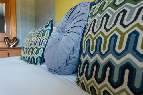 a bed with two pillows on top of it at The Inn on the Moor Hotel in Goathland