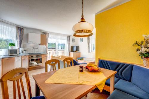 a kitchen with a table with a bowl of fruit on it at Adlerhorst in Serfaus