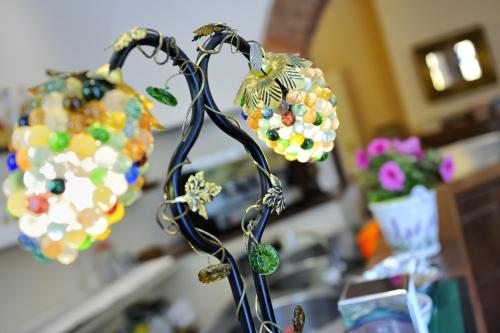 a bunch of beads are attached to a metal object at Hotel al Corso in Legnano
