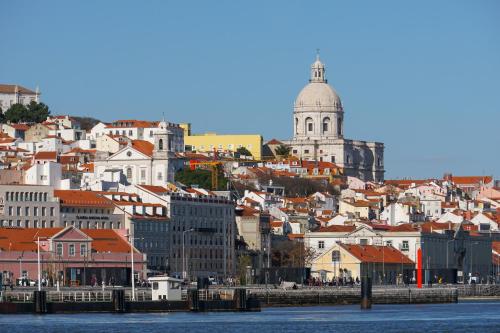 a view of a city from the water at Minty of Kip in Lisbon