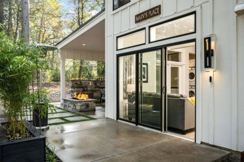 a house with a sliding glass door with a fireplace at Marv's Place in West Linn