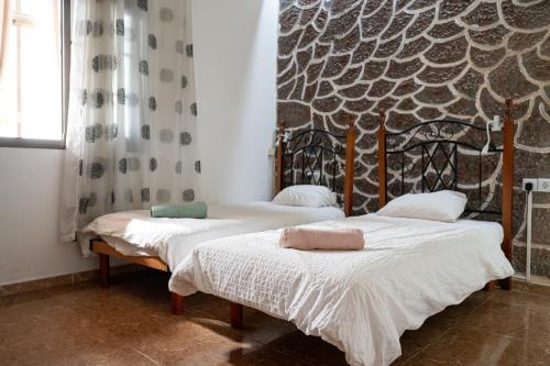 A bed or beds in a room at Drago Hostel