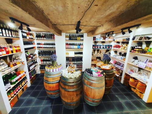 a store with a bunch of bottles of wine at Sousedi Pavlov in Pavlov