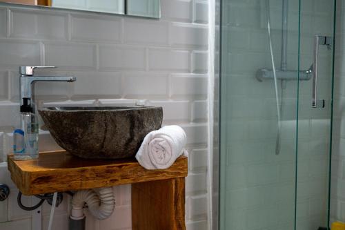 a bathroom with a sink and a shower at Drago Hostel in Icod de los Vinos