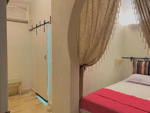 Cama o camas de una habitación en Hôtel Djerba Authentique - Au centre de Midoun