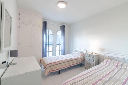 Tempat tidur dalam kamar di Aldea Beach 44 - Bonita casa a pie de playa