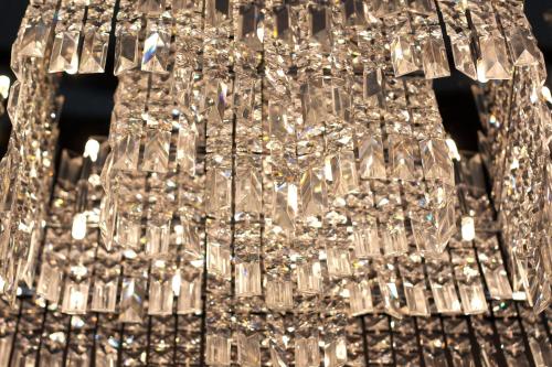 a large silver chandelier hanging from a ceiling at Xavin Wellness Hotel & Restaurant in Harkány