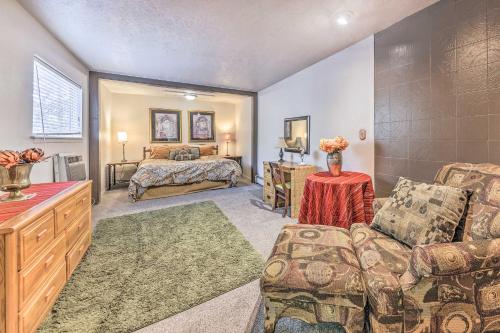 a living room with a couch and a bed at Dog-Friendly Alto Escape with Hot Tub and Foosball! in Alto