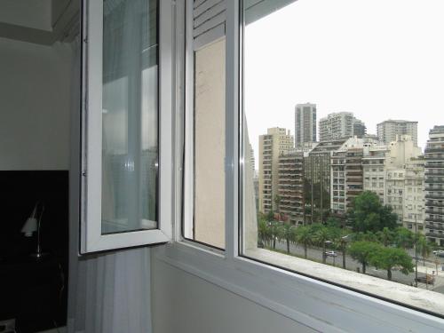 a window with a view of a city at Recoleta Luxury Apartment in Buenos Aires