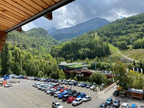 a parking lot with a bunch of cars parked at Casa Tere Panticosa in Panticosa