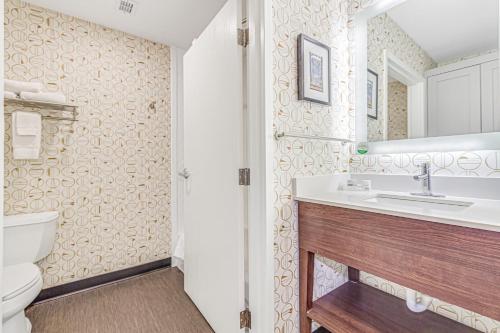 a bathroom with a sink and a toilet at Holiday Inn Spartanburg Northwest in Spartanburg