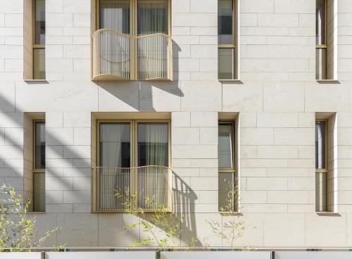 a building with balconies on the side of it at Rosetti Hotel in Bucharest