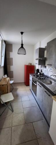 a kitchen with a sink and a stove top oven at Apartment Simone in Lecce