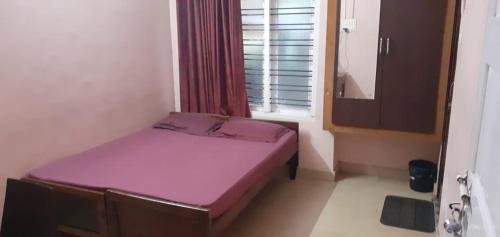 Una cama o camas en una habitación de JEENA MOTEL