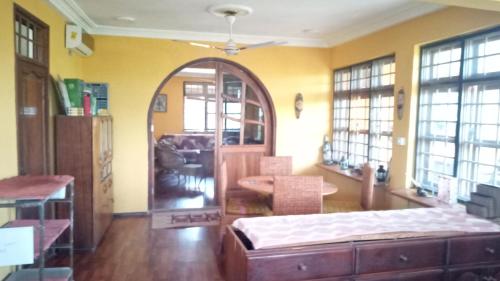 a bedroom with a bed and an arched doorway at Ocean Gaze in Accra