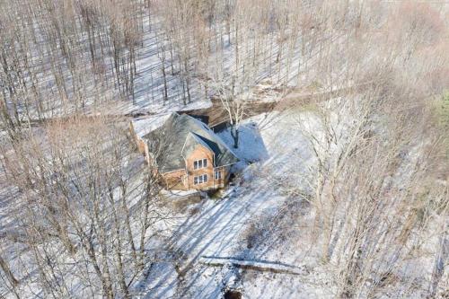 an aerial view of a house in the snow at Catskills Enchanted Forest in Bloomville