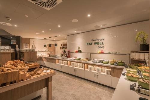 a bakery with many different types of food on display at Holiday Inn - Hamburg - Berliner Tor by IHG in Hamburg