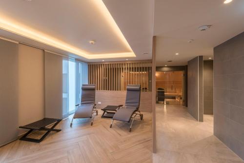a meeting room with chairs and a table in a building at Holiday Inn - Hamburg - Berliner Tor by IHG in Hamburg