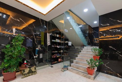 a staircase in a building with potted plants at Petra Elite Hotel in Wadi Musa