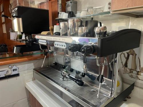 a coffee machine sitting on a counter in a kitchen at Aseel Alsharq Serviced Apartments - اقتصادي in Riyadh