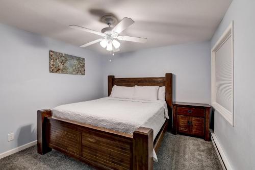 a bedroom with a bed and a ceiling fan at WFC Lakefront Views Family or Romance in Wisconsin Dells