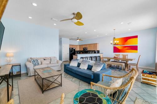 a living room with a couch and a table at Turtle Ridge in Pensacola Beach