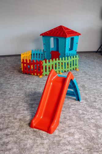 a plastic toy play house and a slide at Hotel Forest in Pale