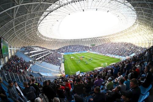 a crowd of people watching a soccer game in a stadium at Lovely flat with bathtub 5 mins from center in Craiova